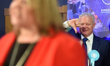 Brexit party candidate Mike Greene gives a thumbs down as Lisa Forbes gives her winner’s speech