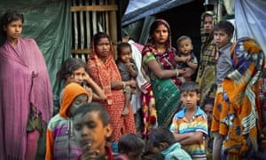 Rohingya Hindu refugees stand outside their make shift shelters at a refugee camp near Cox’s bazar, Bangladesh.