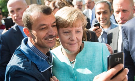Angela Merkel has a selfie taken with a refugee during a visit to a refugee reception centre in Berlin last September.