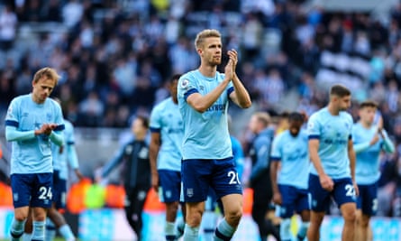 Kristoffer Ajer applauds the Brentford fans at Newcastle in October 2022