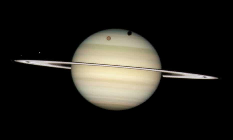 saturn overtakes jupiter as host to most moons in solar system saturn the guardian