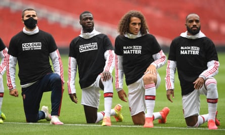 Arsenal’s Sead Kolasinac, Nicolas Pépé, Matteo Guendouzi and Alexandre Lacazette take a knee before a friendly against Brentford on Wednesday.