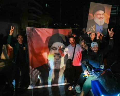 Hezbollah supporters in Beirut hold photos of assassinated leader Hassan Nasrallah while celebrating the truce