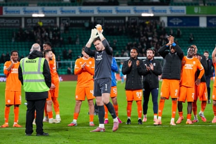 The Rangers goalkeeper Jack Butland applauds the away fans at full time