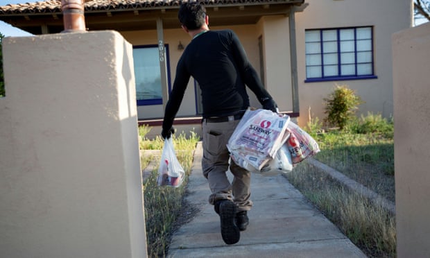 An Instacart worker delivers groceries in Tucson, Arizona, in 2020. 