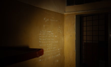The names of the Ukrainian prisoners, including Ivan Kovryga, and the number of days they were held were written on the wall of the police station during the Russian occupation.