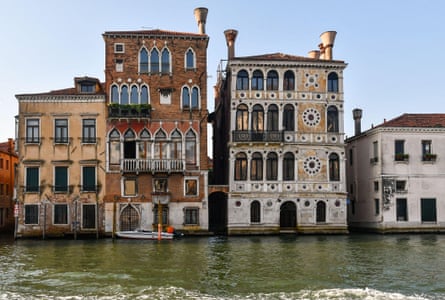 Three grand canalside buildings; Palazzo Salviati is three-storey with peach-coloured plaster over brick, and has plainer rectangular windows; it stands on the corner with a smaller, narrow side canal.