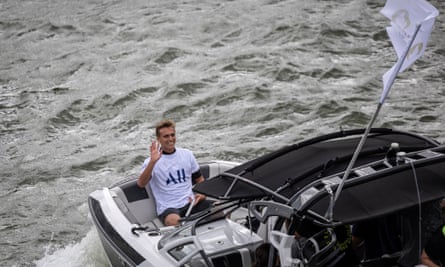 France’s Kauli Vaast, who won surfing gold, celebrates and waves at the public after surfing the Seine