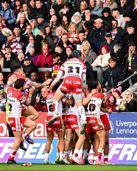 Bill Leyland is mobbed by his St Helens teammates after his second try.