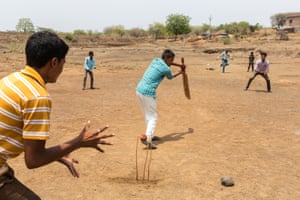Villagers from Ankulga Sayyad play cricket on the bed of a nearby dried-up lake