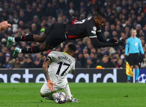 Tottenham Hotspur's Cristian Romero fouls Milan's Rafael Leao before receiving a yellow card.