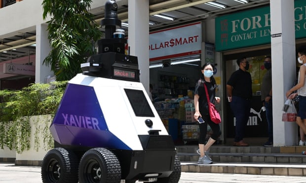 An autonomous robot named "Xavier" patrols a shopping and residential district during a three-week trial by the Home Team Science and Technology Agency (HTX) in Singapore.