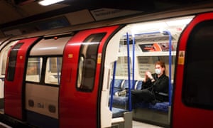 A person wearing a face mask on the London underground on 15 March.