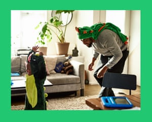 Young boy being chased by dad in fancy dress costume at home, carefree, fun, childhood