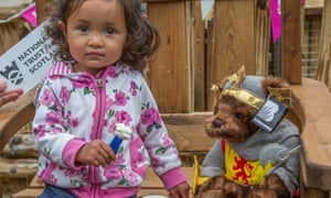 Small girl and dressed-up teddy, Brodick Castle