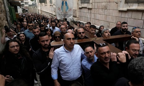 Christians walk the Way of the Cross procession that commemorates Jesus Christ's last day, on Good Friday, in the Old City of Jerusalem.