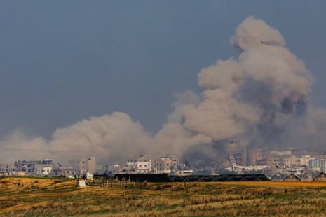 Smoke rises in Gaza, as seen from southern Israel on 6 December.