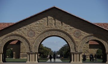 FILE - Pedestrians walk on the campus at Stanford University in Stanford, Calif., April 9, 2019. Stanford University said it found a noose hanging from a tree outside of a residence hall and is investigating the incident as a hate crime. In an email to students and staff, university officials said campus safety authorities immediately "removed the noose and retained it as evidence," after receiving a report late Sunday, May 8, 2022, that a noose was seen outside an undergraduate dormitory. (AP Photo/Jeff Chiu, File)