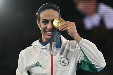 Algeria’s Imane Khelif poses on the podium during the medal ceremony