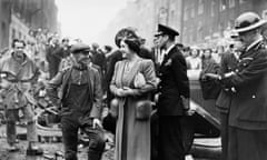 George VI and Queen Elizabeth survey the damage of an air raid in 1940