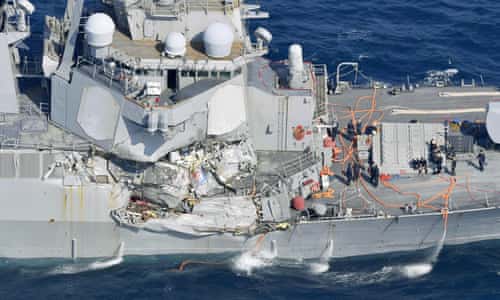 Seven crew missing after US navy destroyer collides with merchant ship