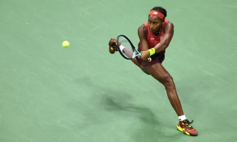 Coco Gauff returns a shot against Aryna Sabalenk.