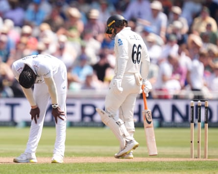 The England fast bowler Jofra Archer puts his hands on his knees in frustration after a dropped catch reprieved the New Zealand batter Tom Blundell