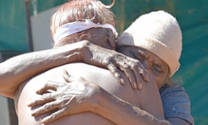 Willowra women embrace at the 90th anniversary of the Coniston massacre in 2018