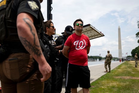 Christian Miles plans to contest obscenity charge after being arrested near Trump’s reflecting pool; he protests against security crackdown.