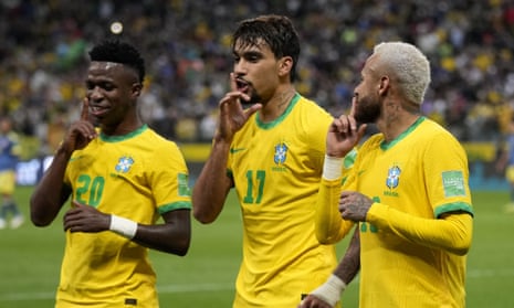 Brazil's Lucas Paquetá is flanked by Vinícius Jr and Neymar as he celebrates his goal against Colombia