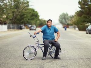 Low Rider (Finalist)Portrait of Alvaro sitting on his custom Low Rider bike. “True Memories” — a group or car enthusiasts in Palmdale, California — allowed me to photograph them for a day, capturing portraits, details of cars and empty landscapes.