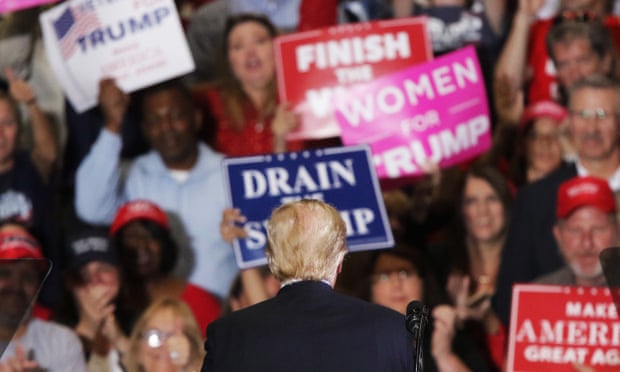 Donald Trump faces the crowd at a rally in Pensacola, Florida for US midterm elections