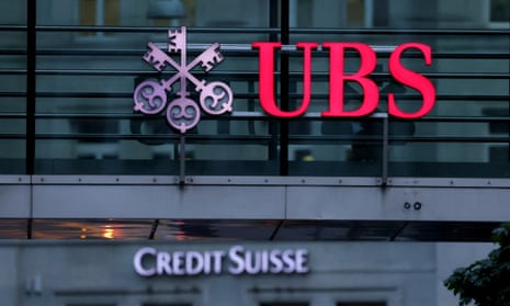 A photo of logos of Swiss banks Credit Suisse and UBS before a news conference in Zurich, Switzerland, on Thursday.