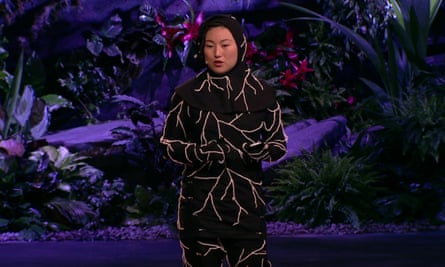 Artist Jae Rhim Lee giving a Ted talk in a special burial suit seeded with pollution-gobbling mushrooms.