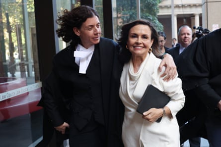 Barrister Sue Chrysanthou SC hugs Lisa Wilkinson as they emerge from the federal court in Sydney