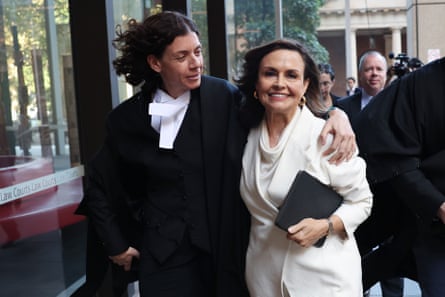 Barrister Sue Chrysanthou hugs Lisa Wilkinson as they emerge from the federal court in Sydney