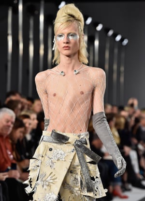 A male model wearing womenswear.