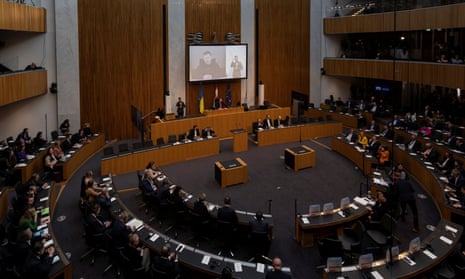 Ukrainian President Volodymyr Zelenskiy addresses Austria’s lower house of parliament, including empty seats.