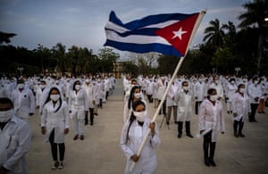 A brigade of health professionals, who volunteered to travel to South Africa to assist local authorities with an upsurge of coronavirus cases, attend the farewell ceremony in Havana, Cuba