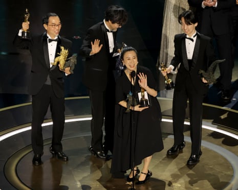Masaki Takahashi, Takashi Yamazaki, Kiyoko Shibuya and Tatsuji Nojima accept the Best Visual Effects award for Godzilla Minus One