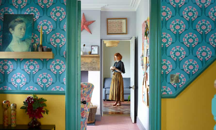 Blue patterned wallpaper and mustard yellow in the hallway
