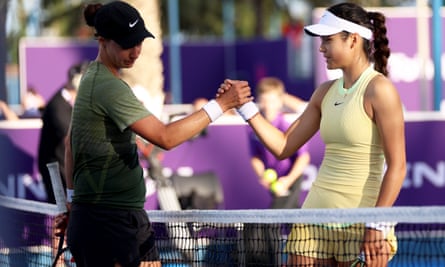 Emma Raducanu (right) shakes hands with Anhelina Kalinina after her straight sets defeat in their first round match during the Qatar Open in Doha on 12 February 2024
