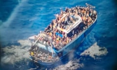 The boat carrying migrants before it sank off the coast of Greece. Human Rights Watch and Amnesty International say the investigation into the incident is failing to make progress