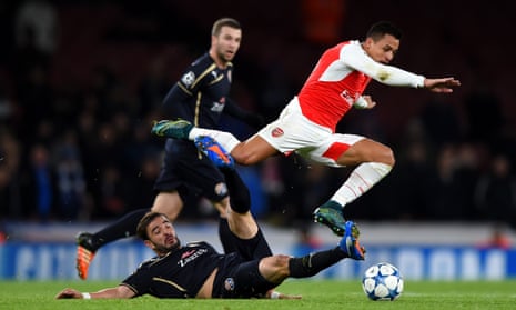 Alexis Sánchez attempts to hurdle a challenge from Goncalo Santos of Dinamo Zagreb on a night when the Chilean helped keep Arsenal’s Champions League hopes alive.