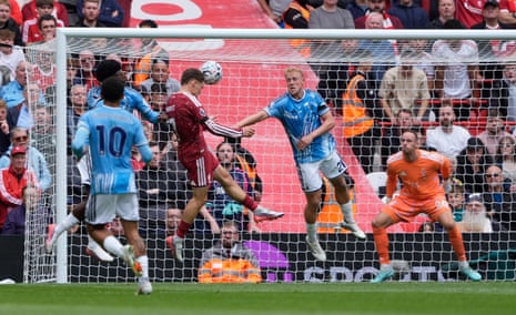 Liverpool's Florian Wirtz heads at goal before a save by Nottingham Forest goalkeeper Matz Sels.