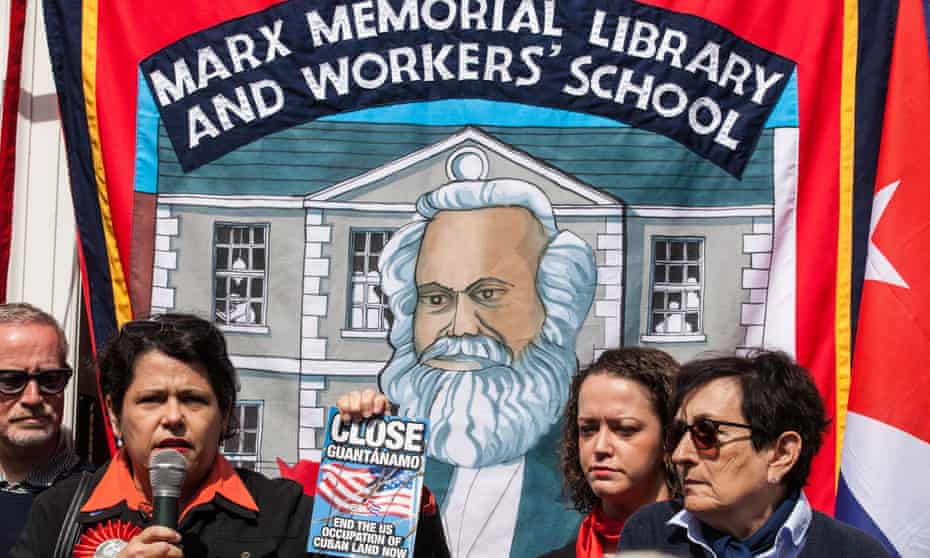 A Marx Memorial Library flag is flown at a May Day rally in London.