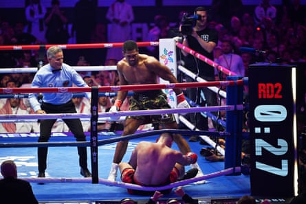 Anthony Joshua decisively knocks down Albania’s Kristian Prenga in the second round