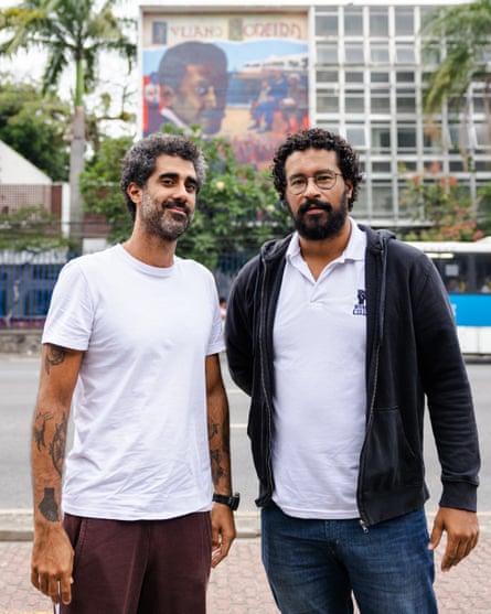 Fernando Cazé and Pedro Rajão, in front of one of the murals painted for the NegroMuro project.