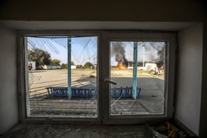 A fire blazes at a local factory following shelling during the fighting over the separatist region of Nagorno-Karabakh.
