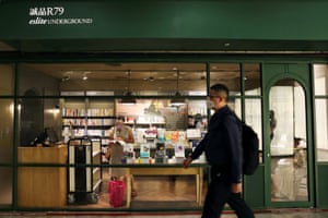 A man walks past a bookstore in an underground shopping centre